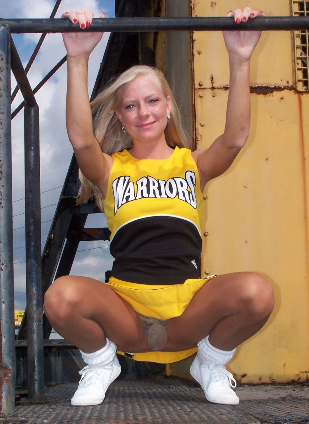 Blonde Cheerleader showing Upskirt in Tan Nylon Shiny Tights and Yellow Miniskirt